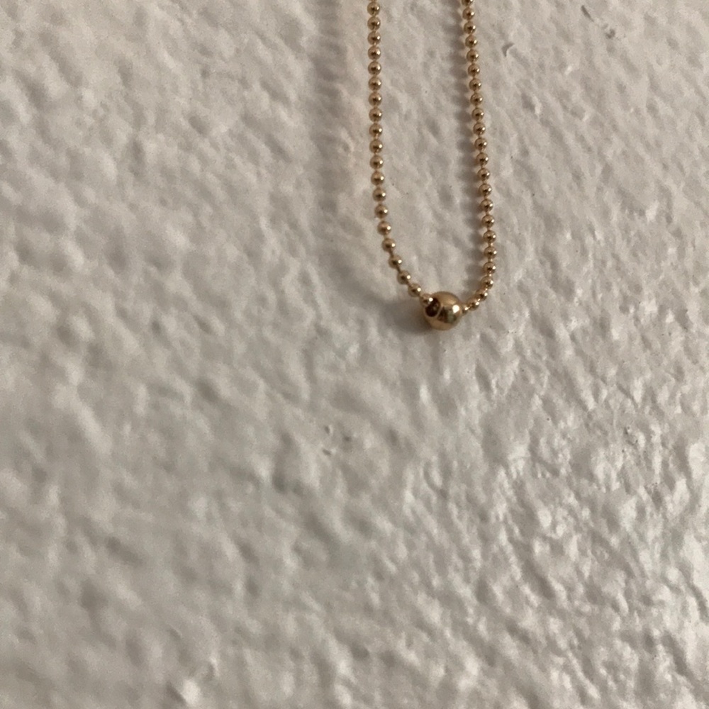 Gold ball on chain choker from Israel